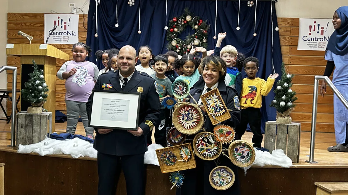 Children Posing on Stage with Law Enforcement Officials