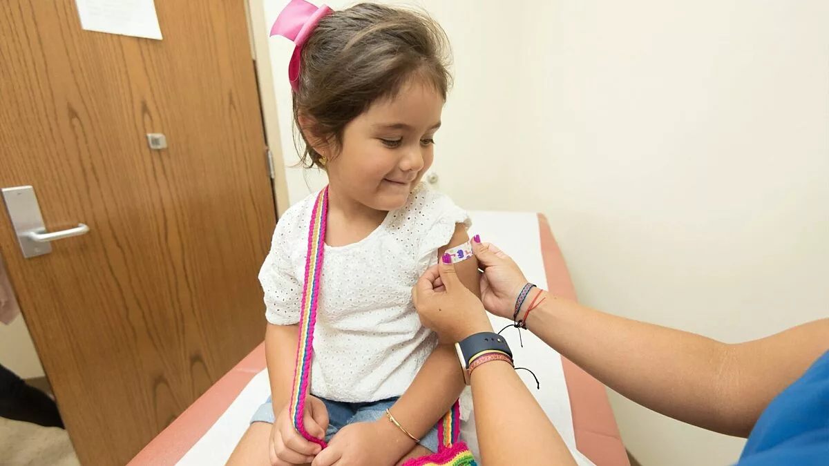 cdc TDoPeUSOD1c unsplash.jpg Kid getting a bandaid put on their arm