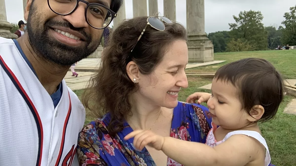 Two Adults with an Infant